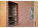 Close up on brick kitchen grill and built in oven at 5285 E Iliff Ave, Denver, CO 80222