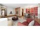 Inviting living room featuring a fireplace, hardwood floors, and stylish furniture, perfect for entertaining at 5285 E Iliff Ave, Denver, CO 80222