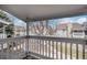 Balcony view overlooking a tree-lined walkway and neighboring condo units for a peaceful ambiance at 13241 E Asbury Dr # 203, Aurora, CO 80014