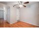 Bright bedroom with a ceiling fan and a closet, complemented by stylish hardwood flooring at 13241 E Asbury Dr # 203, Aurora, CO 80014