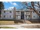 Inviting condo exterior featuring balconies, stone accents, and well-maintained landscaping for a charming curb appeal at 13241 E Asbury Dr # 203, Aurora, CO 80014