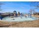 Brightly colored playground with swings and slides in a neighborhood park at 13241 E Asbury Dr # 203, Aurora, CO 80014