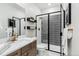 Contemporary bathroom featuring sleek fixtures, modern shower, and stylish design elements at 17125 W 92Nd Loop, Arvada, CO 80007
