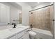 Modern bathroom highlighting a tiled shower-tub combo and stylish black fixtures, adding elegance at 17125 W 92Nd Loop, Arvada, CO 80007