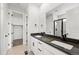 Modern primary bath features double vanity, framed mirrors, and a glass enclosed shower at 17125 W 92Nd Loop, Arvada, CO 80007