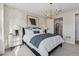 Stylish bedroom featuring decorative wallpaper, modern lighting, and a comfortable bed at 17125 W 92Nd Loop, Arvada, CO 80007