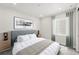 Serene bedroom with a comfortable bed, minimalist decor, and a large window with natural light at 17125 W 92Nd Loop, Arvada, CO 80007