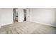 Neutral bedroom with carpet floor, molding, and access to a bathroom at 17125 W 92Nd Loop, Arvada, CO 80007