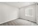 Cozy bedroom with natural light coming from a window, and gray carpet floors at 17125 W 92Nd Loop, Arvada, CO 80007