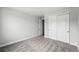 Clean bedroom showcasing a spacious closet with sliding doors for ample storage and organization at 17125 W 92Nd Loop, Arvada, CO 80007