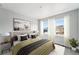 Inviting bedroom with a queen bed, neutral palette, and large windows providing natural light at 17125 W 92Nd Loop, Arvada, CO 80007