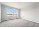 Bright bedroom featuring carpet floors, natural light, and views at 17125 W 92Nd Loop, Arvada, CO 80007