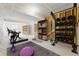 Bright home gym featuring workout equipment, weights, and storage for an active lifestyle at 17125 W 92Nd Loop, Arvada, CO 80007