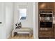Kitchen nook featuring built-in microwave and oven with bench seating and natural light at 17125 W 92Nd Loop, Arvada, CO 80007