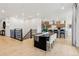 Open-concept kitchen featuring a large island, modern lighting, and sleek stainless steel appliances at 17125 W 92Nd Loop, Arvada, CO 80007