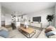 Open-concept living area featuring a modern kitchen, dining space, and comfortable seating area at 17125 W 92Nd Loop, Arvada, CO 80007