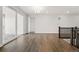 Bright living room with hardwood floors, recessed lighting, and sliding doors leading to the outside at 17125 W 92Nd Loop, Arvada, CO 80007