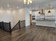Open-concept living space that flows from the kitchen to the living room, with hardwood floors at 17125 W 92Nd Loop, Arvada, CO 80007