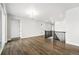 Spacious living room with beautiful hardwood floors and modern light fixture at 17125 W 92Nd Loop, Arvada, CO 80007