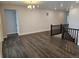 Spacious living room featuring an open layout and hardwood floors, leading to other parts of the house at 17125 W 92Nd Loop, Arvada, CO 80007