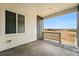 Outdoor patio space for entertaining with a covered area and a view of the surrounding area at 17125 W 92Nd Loop, Arvada, CO 80007