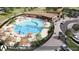 Aerial view of community center featuring a large swimming pool, lounge areas, and recreational facilities at 17125 W 92Nd Loop, Arvada, CO 80007