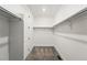 Spacious walk-in closet with shelving and carpet floor at 17125 W 92Nd Loop, Arvada, CO 80007