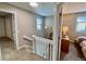 Upstairs hallway with access to bedrooms and stairs at 11604 Community Center Dr # 12, Northglenn, CO 80233