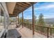 Enjoy stunning mountain views from this covered deck with plenty of space for seating and relaxation at 3961 Mossy Rock Ln, Evergreen, CO 80439