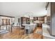 Stylish kitchen with island seating, pendant lights, stainless steel appliances, and dark wood cabinets at 3961 Mossy Rock Ln, Evergreen, CO 80439