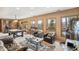 Recreation room with pool table, multiple seating areas, and scenic mountain views at 3961 Mossy Rock Ln, Evergreen, CO 80439