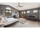 Spacious main bedroom boasts vaulted ceilings, generous natural light, and neutral decor at 3961 Mossy Rock Ln, Evergreen, CO 80439