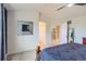 View from bedroom showcasing archway, hallway with stairs, and the continuation of the carpeted flooring at 9921 W Edenburg Pl, Littleton, CO 80127