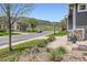 Beautiful house on a tree-lined street with lush landscaping and scenic views at 9921 W Edenburg Pl, Littleton, CO 80127