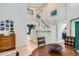 Elegant entryway with a bright staircase and a spacious, open design at 9921 W Edenburg Pl, Littleton, CO 80127