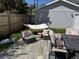 Cozy backyard with outdoor seating, a hammock, and lush greenery at 613 S Logan St, Denver, CO 80209