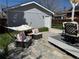 A cozy backyard featuring comfortable seating, a hammock, and an outdoor deck at 613 S Logan St, Denver, CO 80209