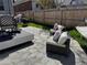 Inviting backyard featuring stone patio, comfortable seating, and a relaxing hammock at 613 S Logan St, Denver, CO 80209