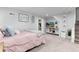 A clean bedroom with plush carpet and a tv area at 613 S Logan St, Denver, CO 80209