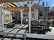 Outdoor deck with a pergola featuring a dining set and lounge seating for enjoying the outdoors at 613 S Logan St, Denver, CO 80209