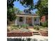 Charming home featuring a cozy front porch and a well-maintained, landscaped front yard at 613 S Logan St, Denver, CO 80209