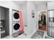 Laundry room has stackable washer/dryer and access to other areas of the home at 613 S Logan St, Denver, CO 80209