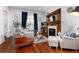 Inviting living room featuring hardwood floors, a decorative fireplace, and comfortable seating at 613 S Logan St, Denver, CO 80209