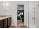 This bathroom leads to the main bedroom and features granite countertops and a glass shower at 5311 Blue Lunar Ln, Castle Rock, CO 80104