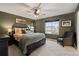 Bedroom with a ceiling fan, and a cozy chair near a window overlooking the neighborhood at 5311 Blue Lunar Ln, Castle Rock, CO 80104
