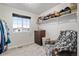 Bedroom with chair, dresser, window and shelf at 5311 Blue Lunar Ln, Castle Rock, CO 80104