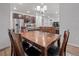 Dining room with wooden table, chairs, adjacent kitchen area, and living room space at 5311 Blue Lunar Ln, Castle Rock, CO 80104