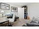 Office space featuring a sofa, desk, bookcase, and window with natural light at 5311 Blue Lunar Ln, Castle Rock, CO 80104