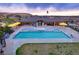 Aerial view of a community pool with a clubhouse and lounge chairs, perfect for relaxation at 5311 Blue Lunar Ln, Castle Rock, CO 80104