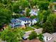 Beautiful modern home nestled among lush green trees in a quiet neighborhood with mature landscaping at 1518 S Columbine St, Denver, CO 80210